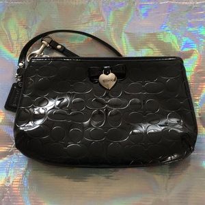 NWOT medium Coach wristlet.